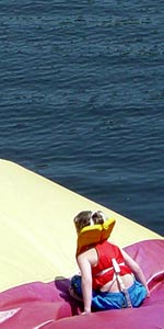 A camper lands on the blob, sending another camper airborne