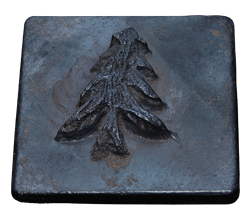 The traditional lead-cast pine tree, the symbol of Alpine Camp